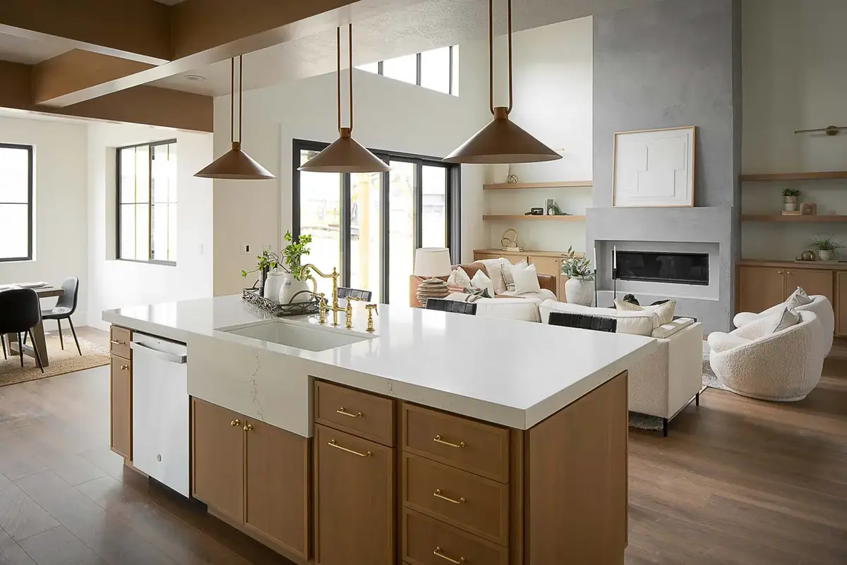 Open kitchen with a wood island and pendant lights